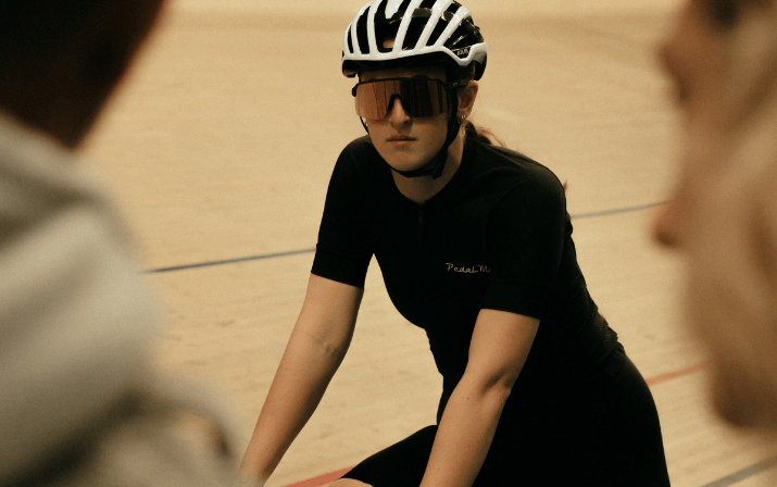 Close up photo of Isla Carr at the Speed Dome in Midvale, Perth Close up photo of Isla Carr on a race bike wearing googles and a helmet at the track cycling Speed Dome in Midvale, Perth